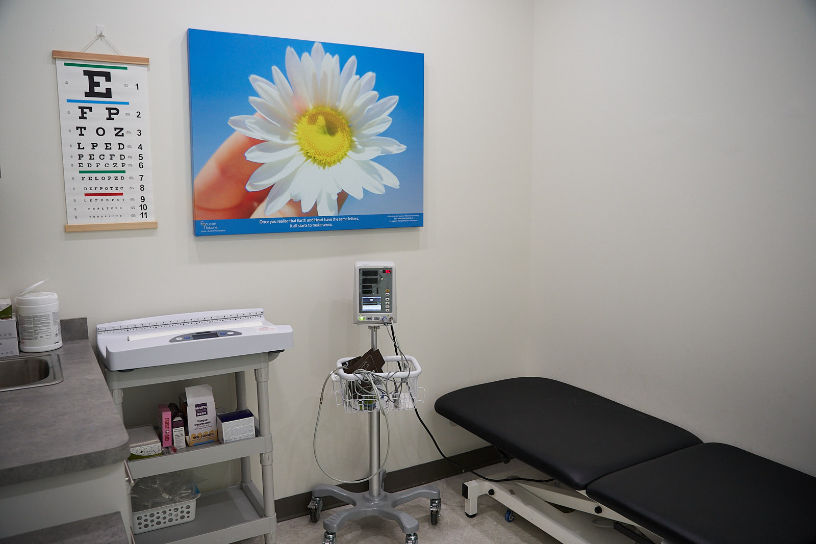 Examination room with exam table and vitals monitor